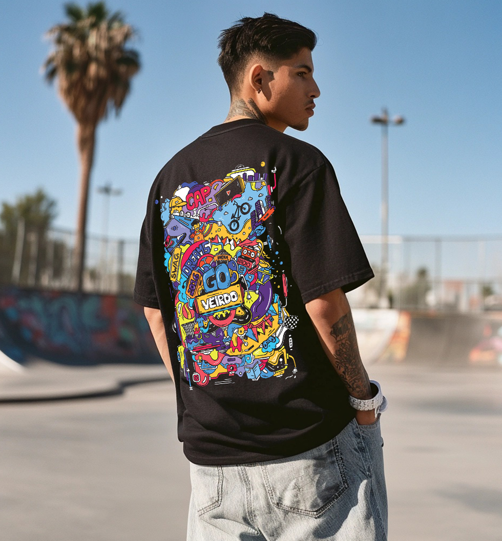 Person wearing a black t-shirt with colorful graphics, standing in an outdoor setting with palm trees.